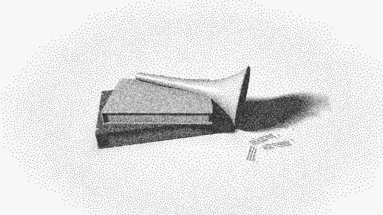 A brass speaking trumpet lying on two books, its bell turned toward the viewer, slips of printed paper spilling from it.